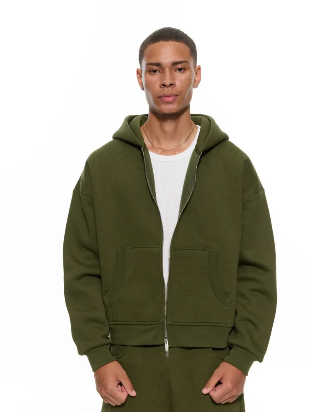 Man wearing a olive zip-up jacket