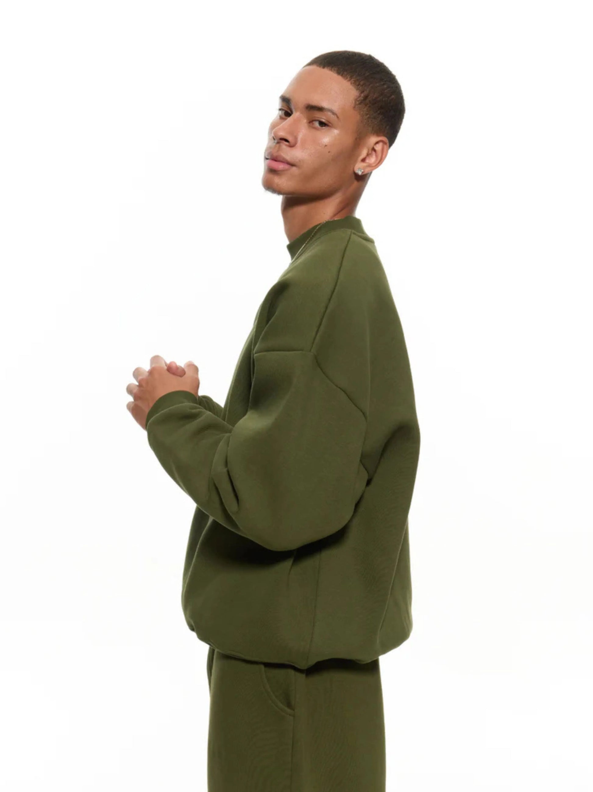 Man wearing olive sweatshirt and sweatpants set