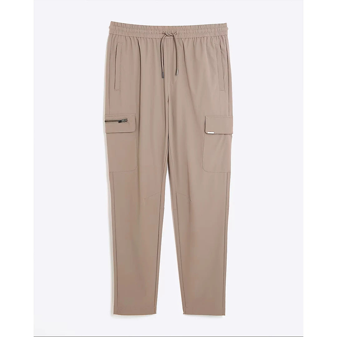 Beige pants with pockets and drawstring on a white background