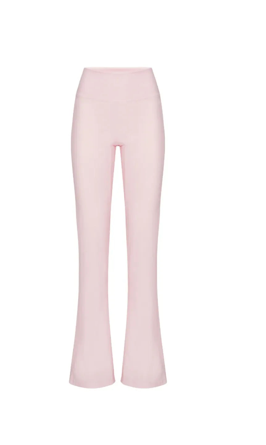 Light pink flared pants on a white background