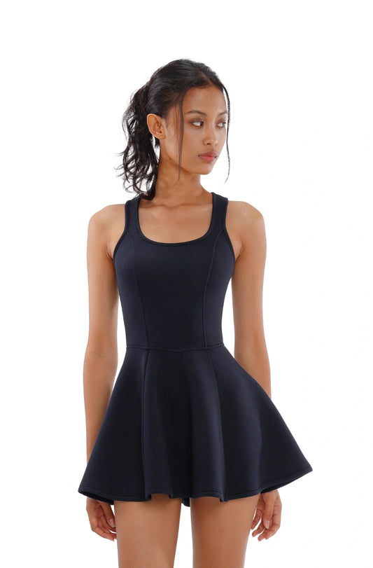 Woman wearing a black sleeveless dress on a white background