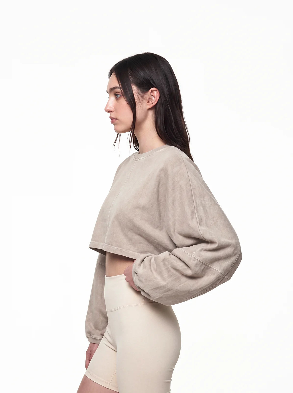 Woman wearing sand color cult cover crop tee