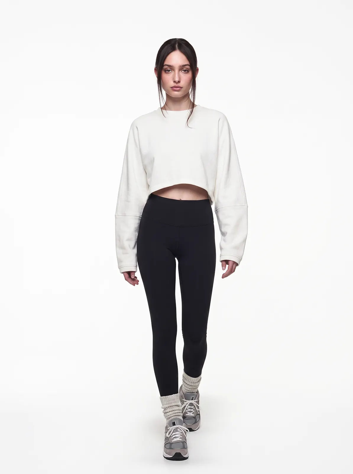 Woman wearing white cult cover crop tee