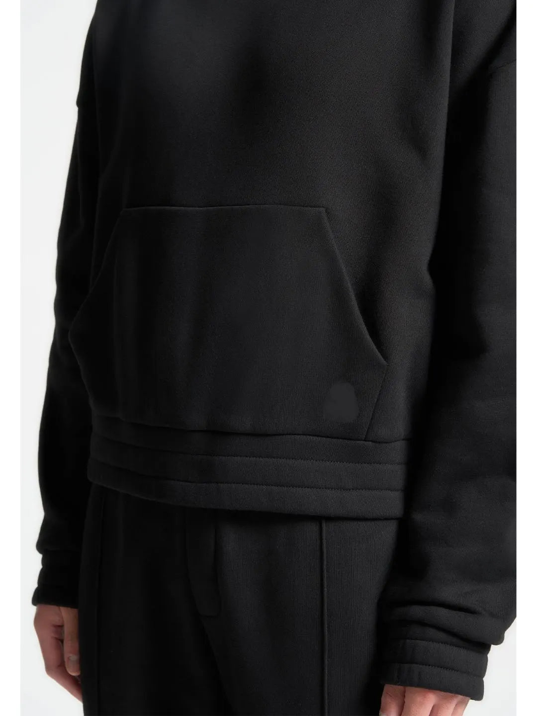 Black hoodie with a pocket on a white background