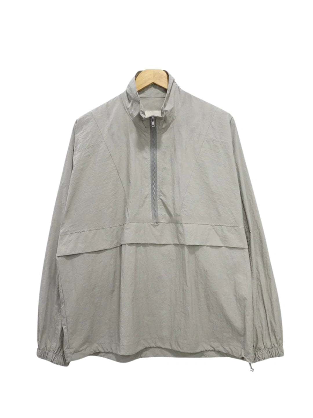 Light grey jacket with a zipper on a white background