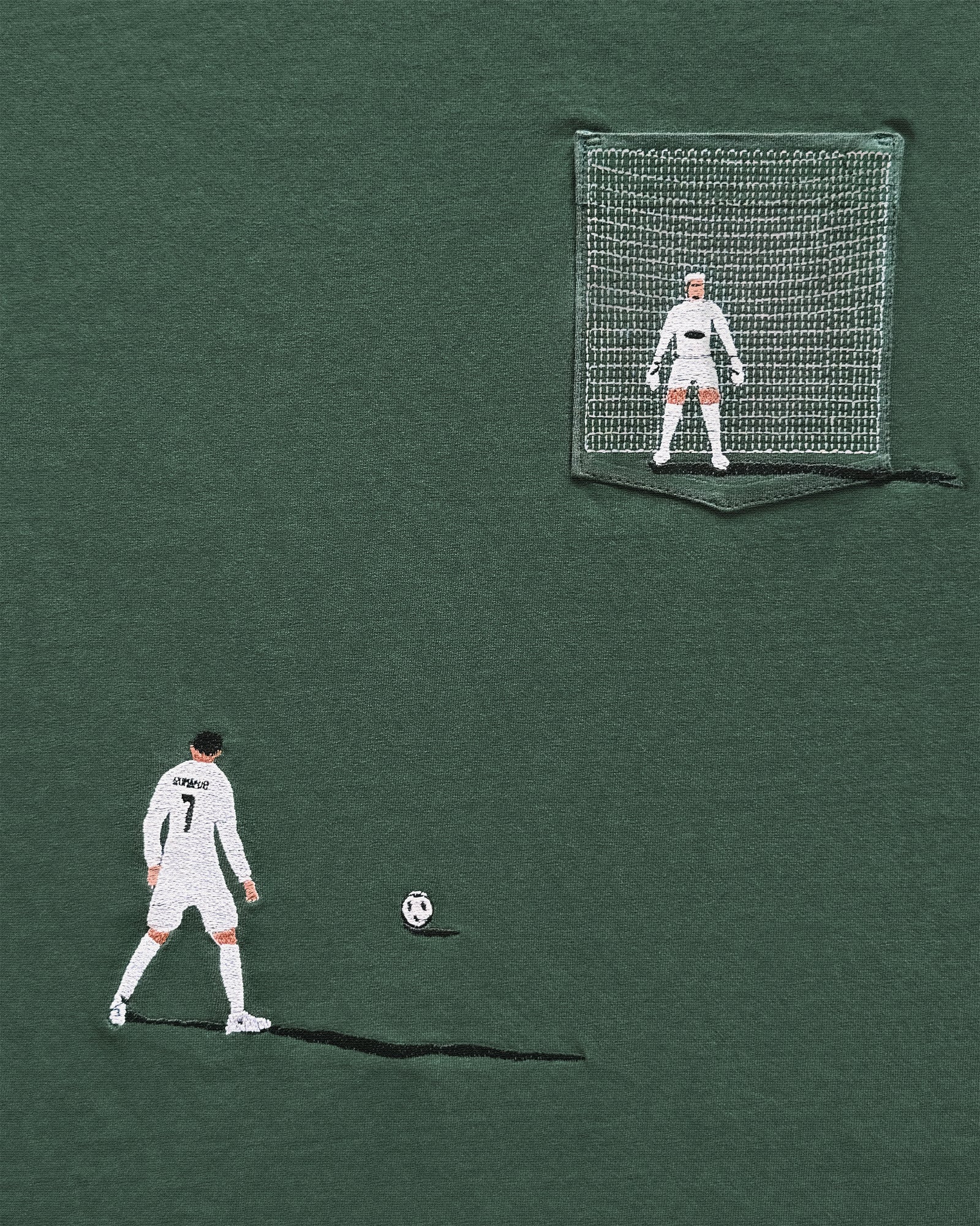 Soccer player with a goalkeeper in a net on a green background