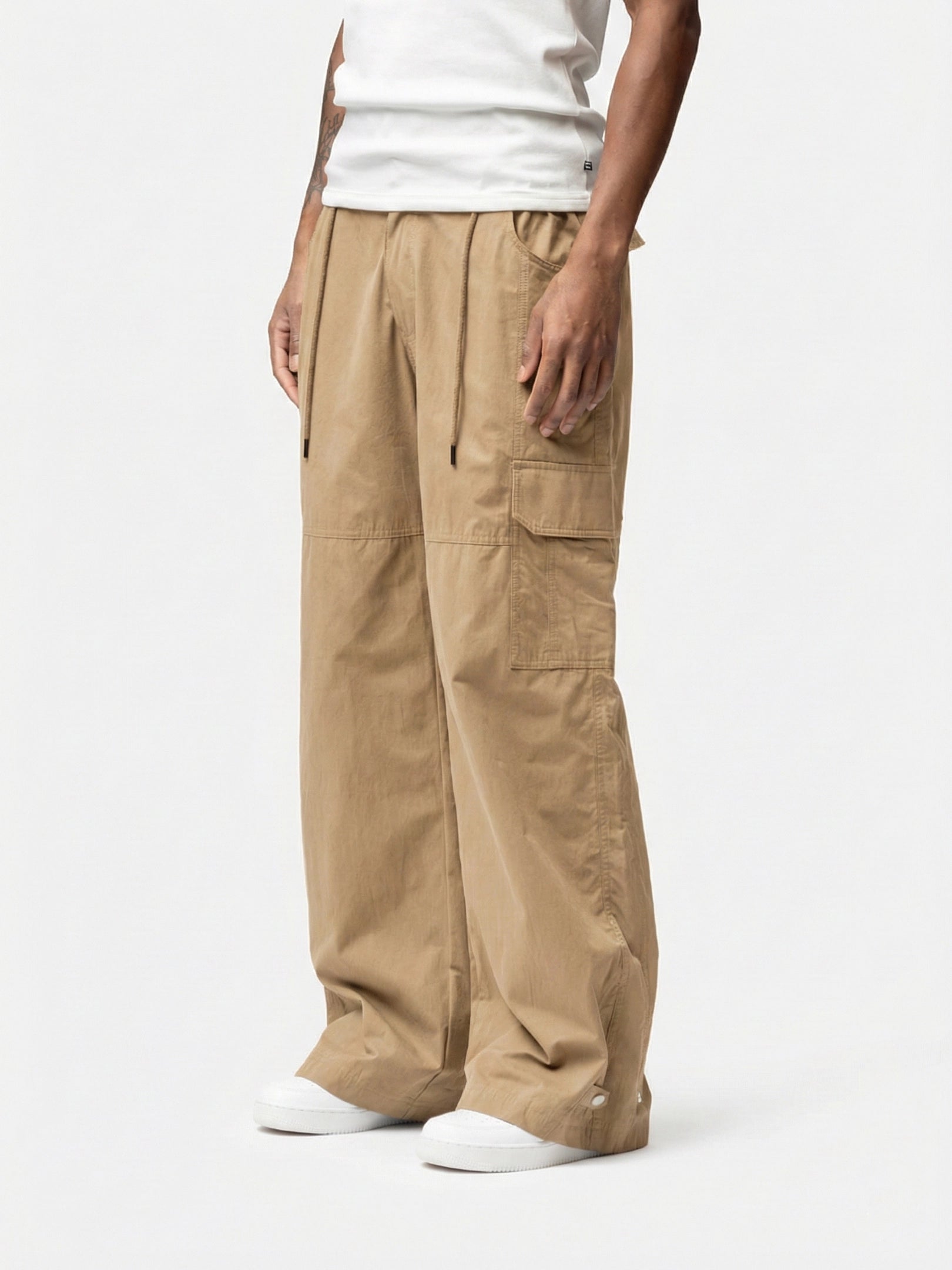 Marasis Beige Cargo Pant designed with oversized cargo pockets and a relaxed fit, it delivers raw street energy with all day comfort. Easy to style, hard to ignore, and made for days that turn into nights.