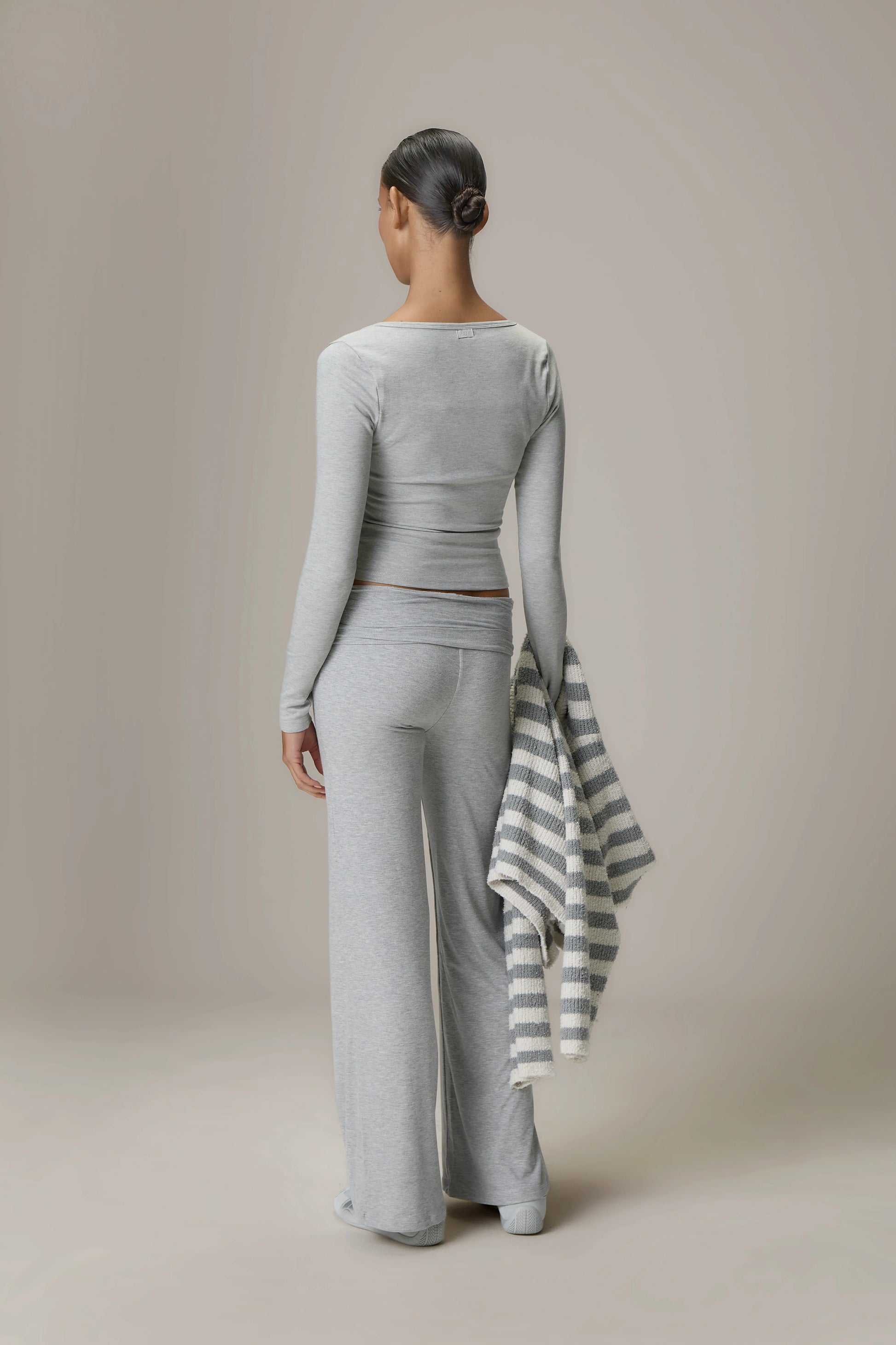 Scoop Neck Top and Fold Over Pant Grey set brings together comfort and contemporary style for everyday wear. The relaxed scoop neck top offers a soft, flattering silhouette that pairs effortlessly with the coordinating fold over pants, crafted in a lightweight, stretch fabric for all-day ease.
 