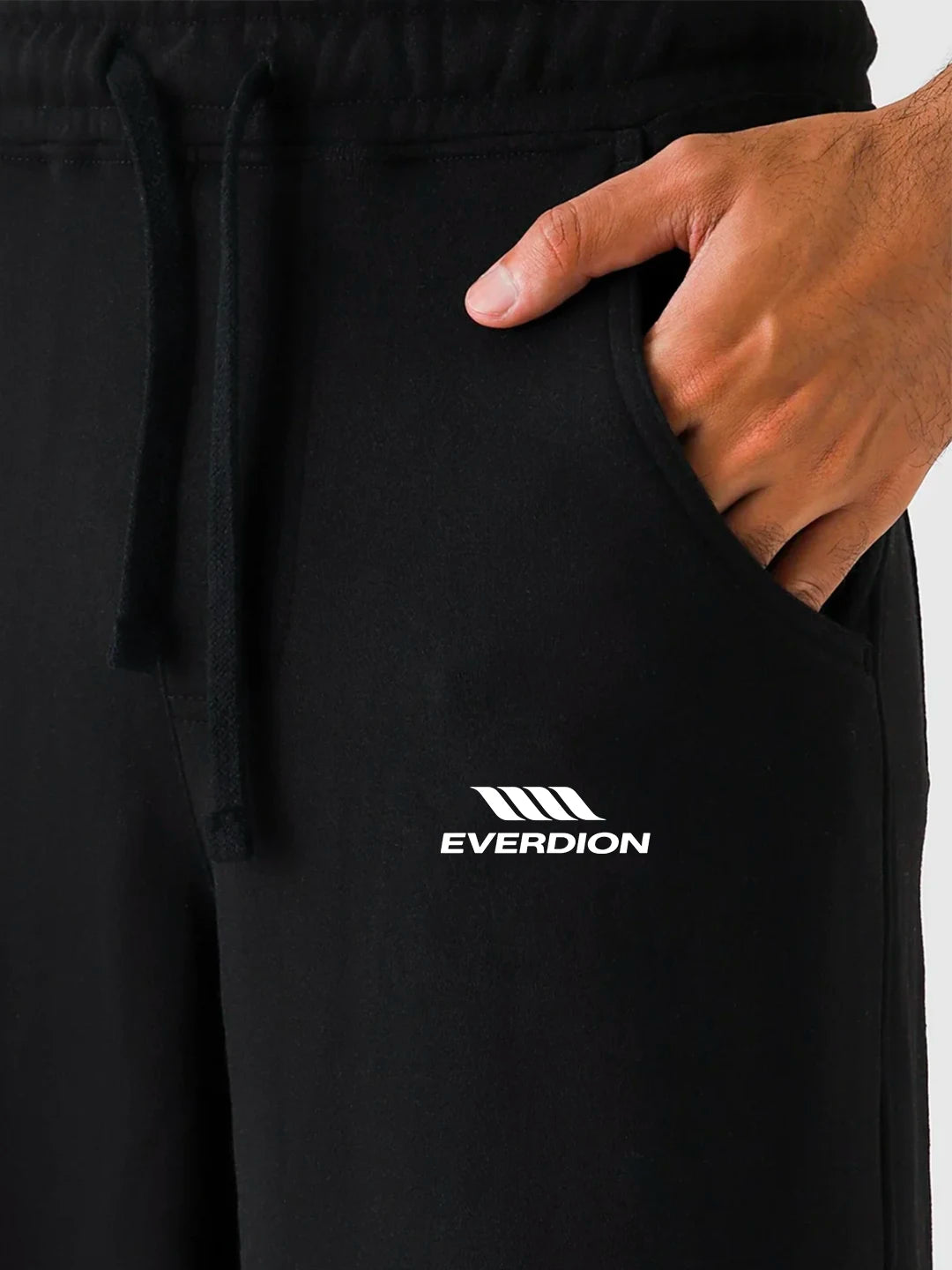 Black pants with 'EVERDION' logo on a white background