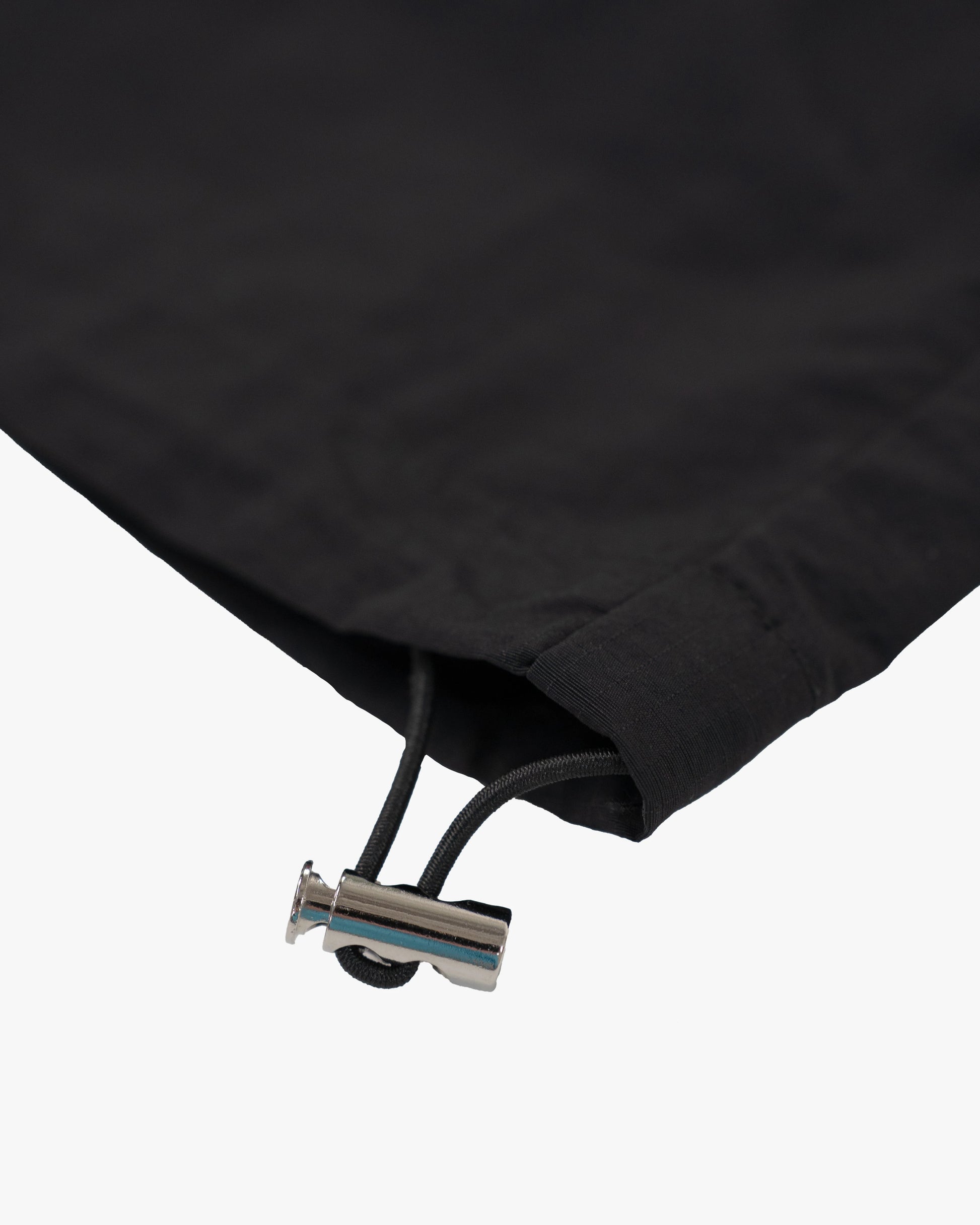 The Black pant delivers a structured yet lightweight feel, while the relaxed-fit track pants ensure fluid movement and all-day comfort. 