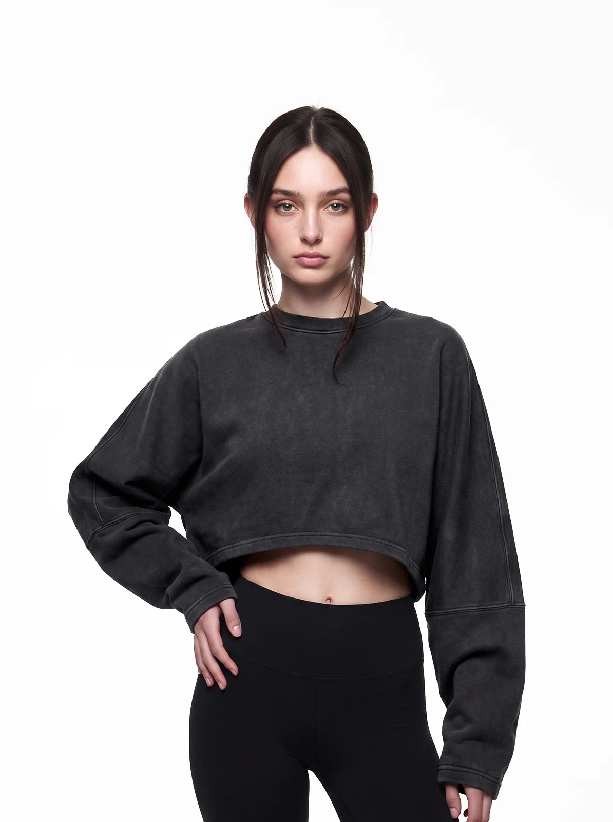 Woman wearing washed black cult cover crop tee
