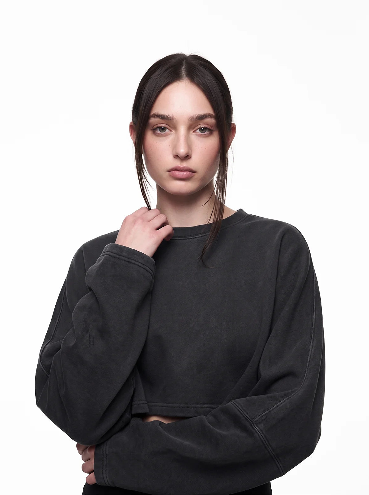 Woman wearing washed black cult cover crop tee