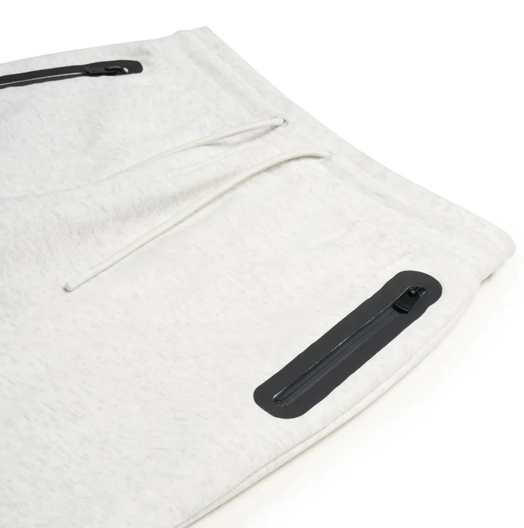 White fleece jacket with black zipper on a white background