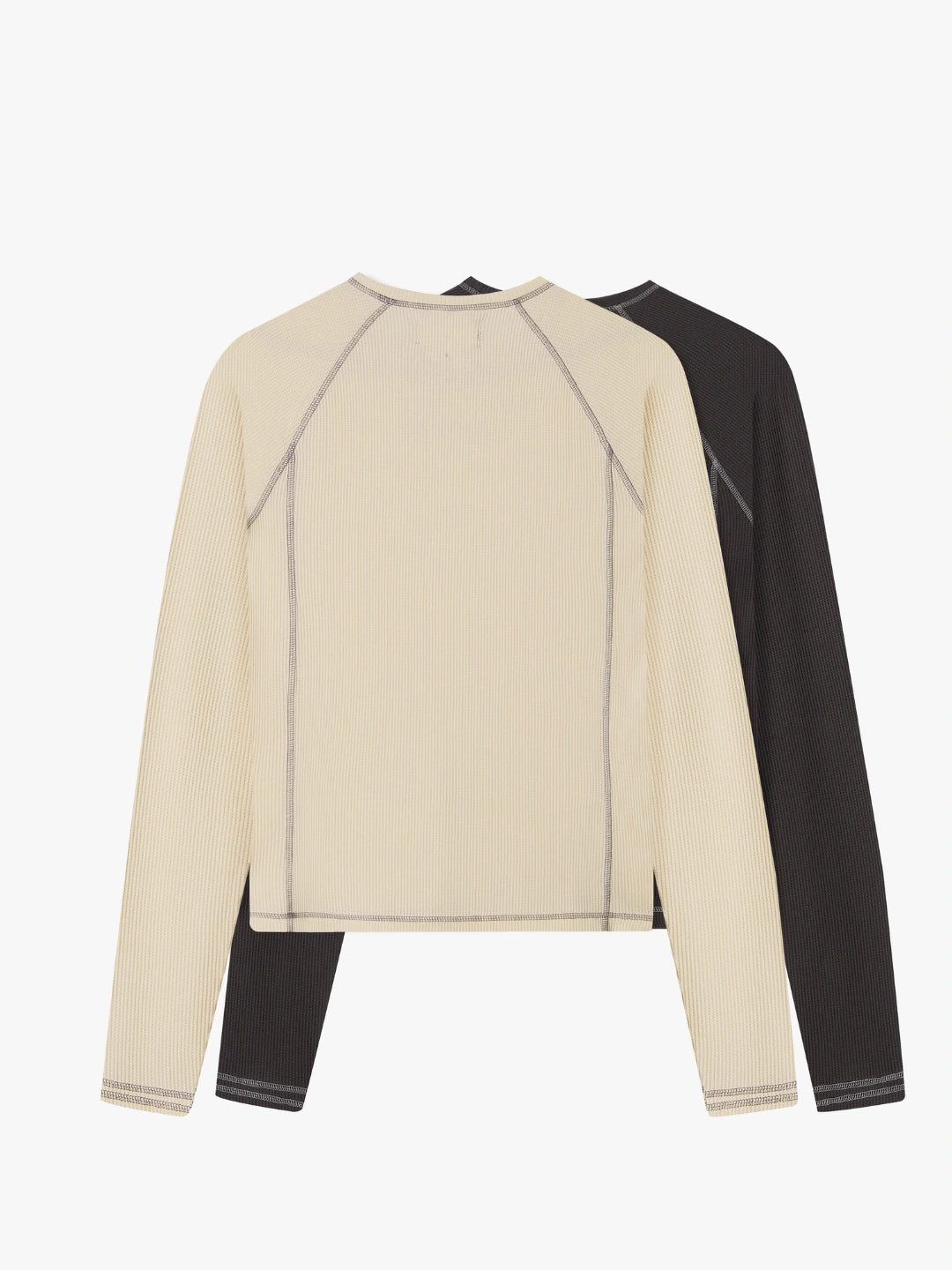 Two long sleeve tee, one beige and one black, on a white background
