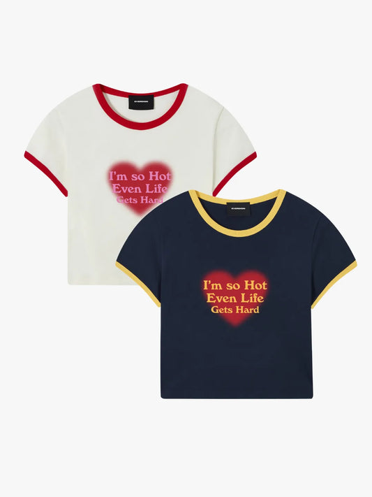 Two t-shirts with heart designs and text on a white background