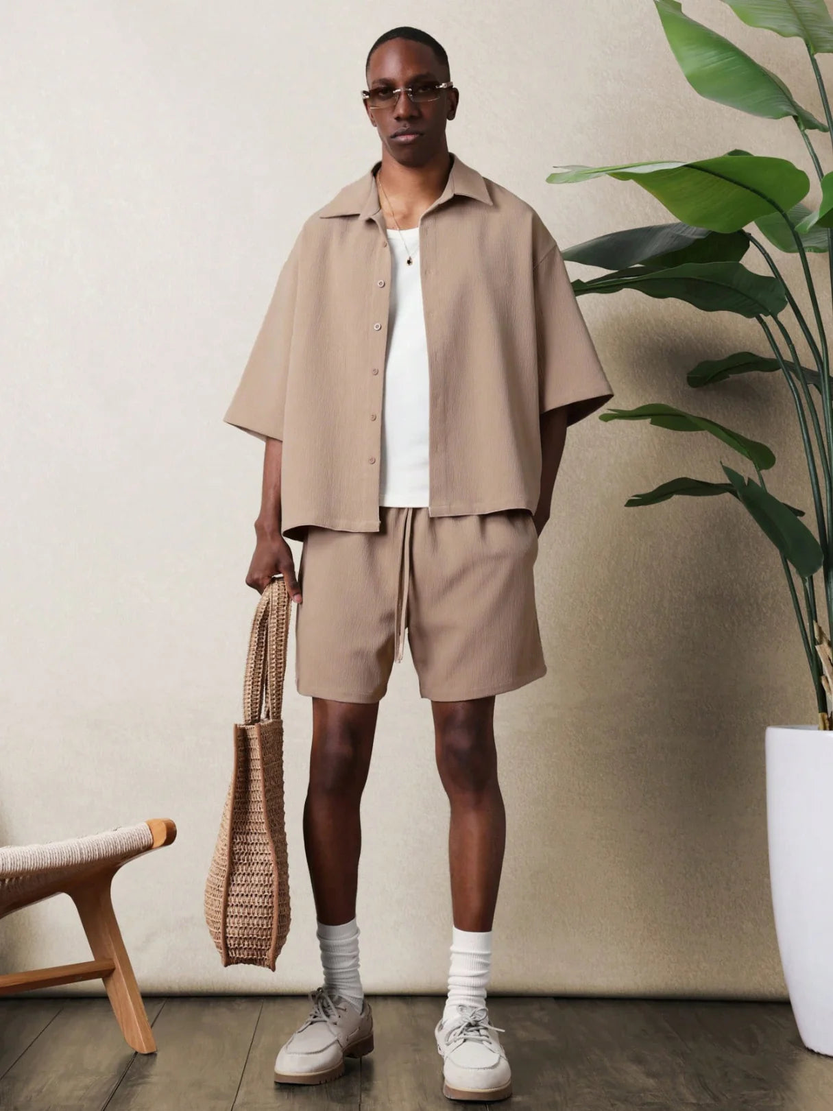 Man in beige shirt and shorts outfit set
